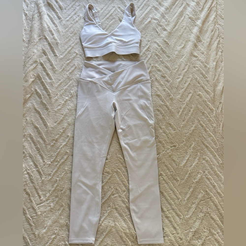 White Fabletics leggings and sports bra set